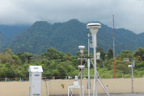 Meteorological weather equipment in cloudy, tropical hills.