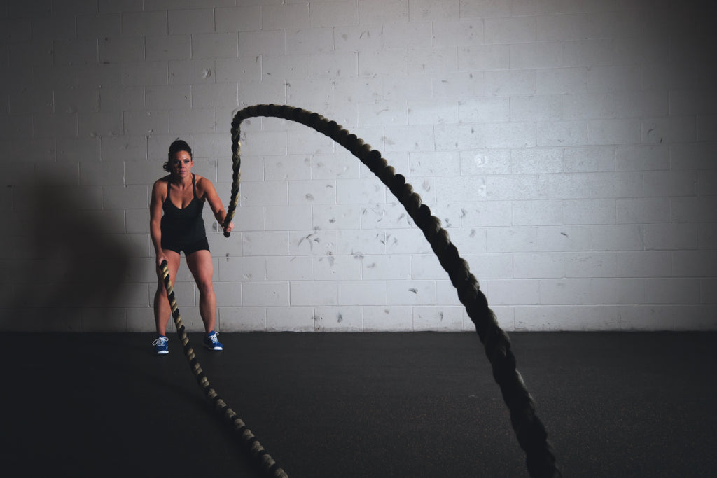 girl lifting rope