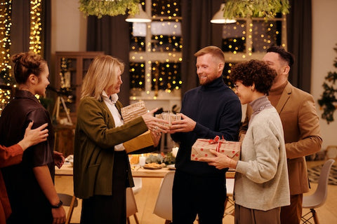 A family giving gifts to one another.