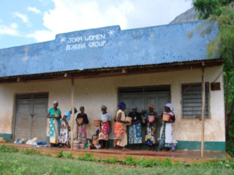 jora women in front of house