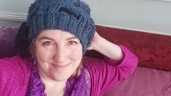 Amanda Coen in her crocheted hat promoting her YouTube Channel called AmandasParade - Parade Handmade