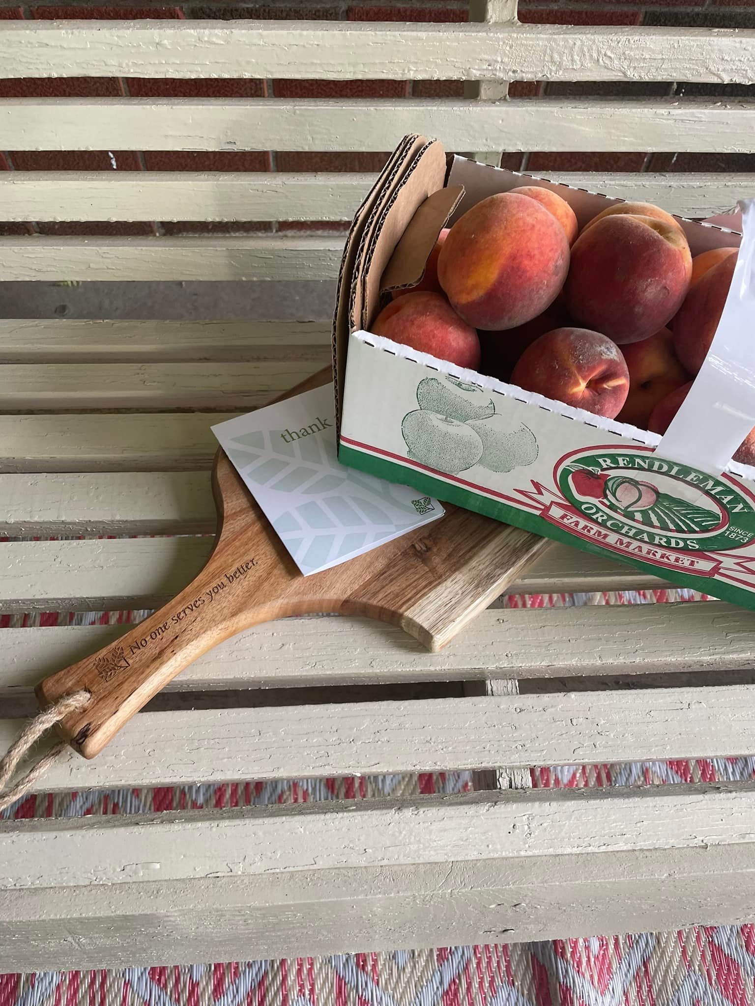 Image of Rendleman Orchards peck of peaches given to Farmers State Bank customers.