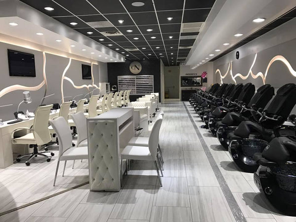 Chic Nails in Little Rock, AR. White manicure tables and black Whale Spa chairs. Led lights in the walls.