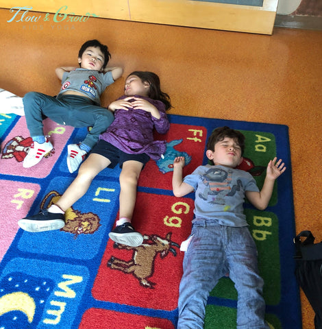 Children resting on the rug at an early childhood center