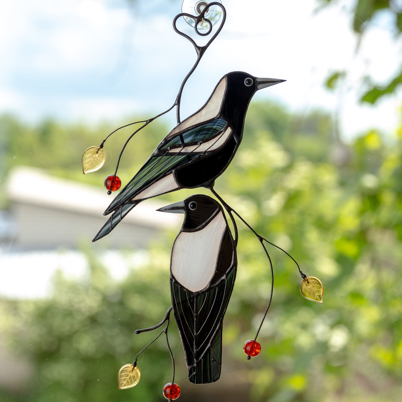 2 stained glass Australian magpies one below and one above suncatchers