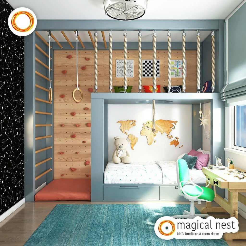 A cozy bed and activity area of a boys’ kids’ room with a study desk by the bed.