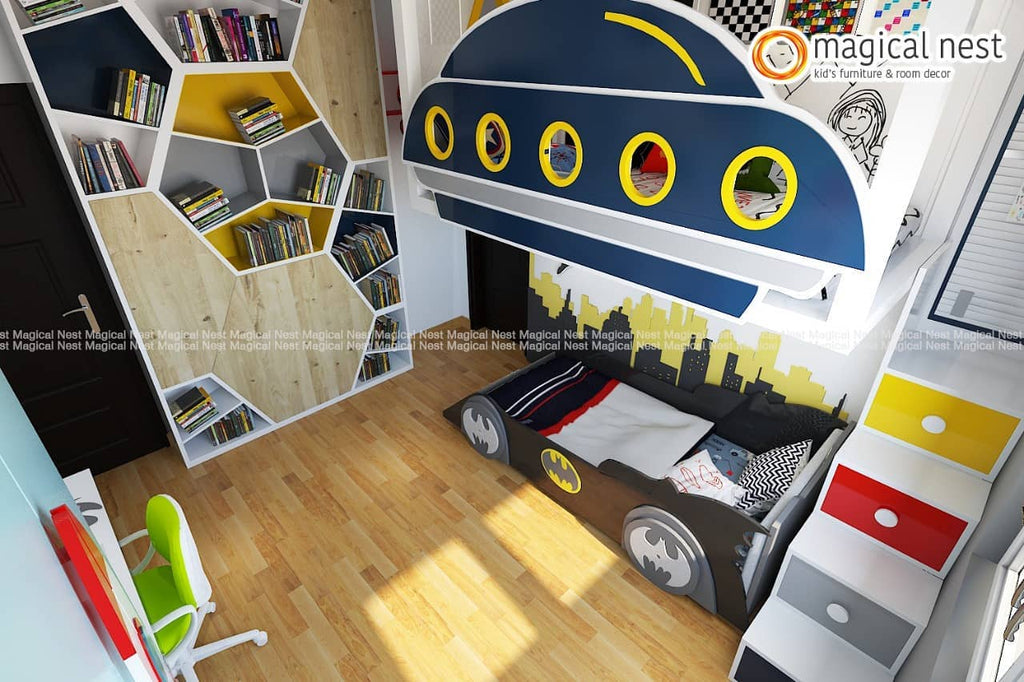 A bat-mobile bed with batman logo on the wheels and Gotham city wallpaper, loft area and fancy bookshelf.