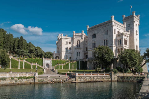 Water view of the Miramare castle and yard