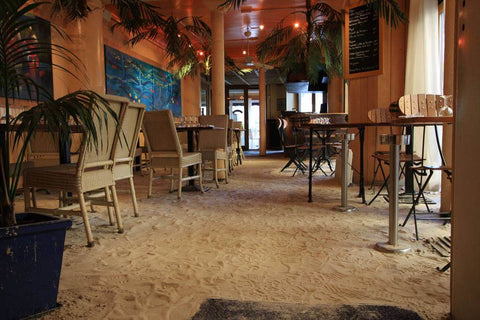 Dining in artificial sand in a restaurant in paris