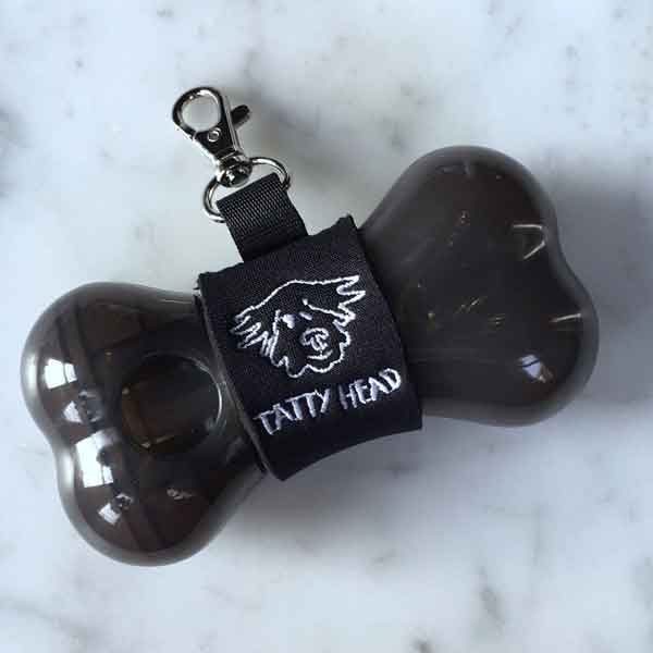 keep your dog biscuits in a grey tatty head dispenser