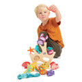 Wooden stacker toy for kids with sea theme and caucasian boy playing - PomPom