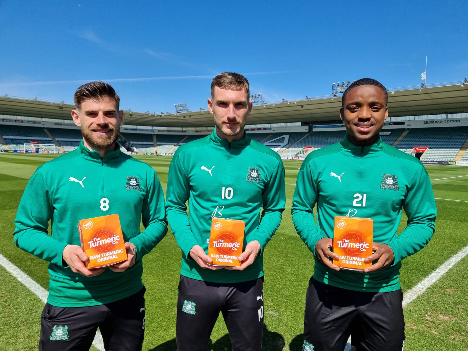 Plymouth Argyle football players with The Turmeric Co shots