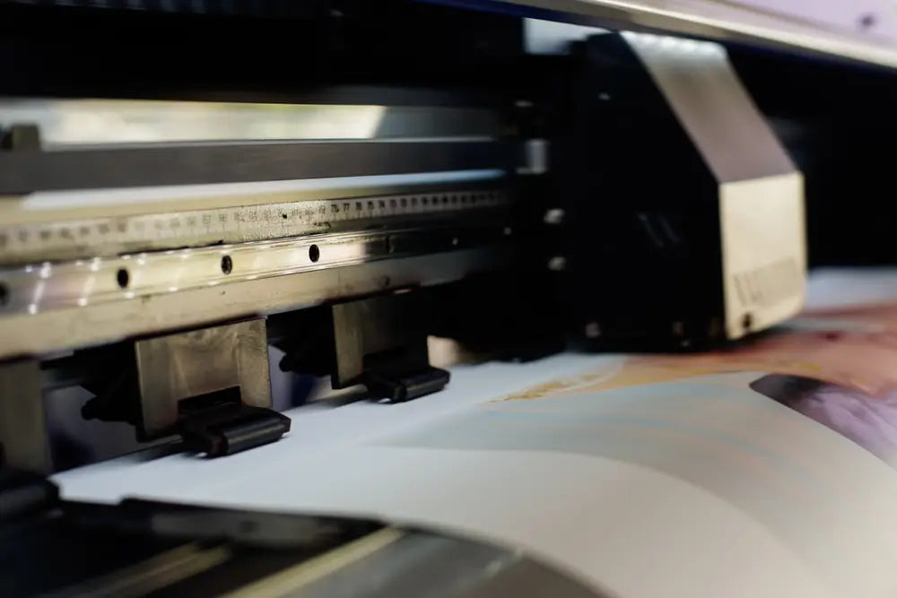 DTF printing transfers designs from film to fabrics using inks, powder, and a heat press.