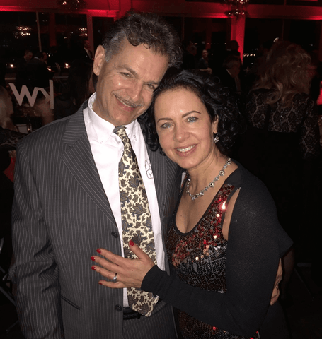 Dark Winter Gia Pauldine with husband in her sparkly dress