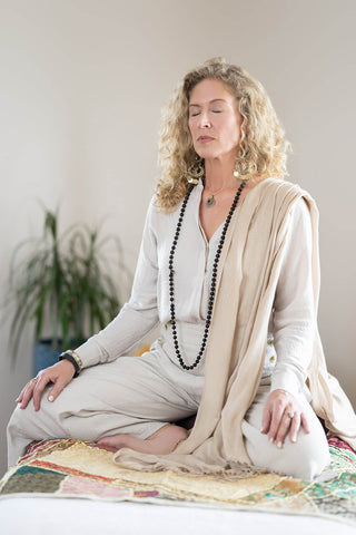 Light Spring Dana Emmings in light clothing meditating