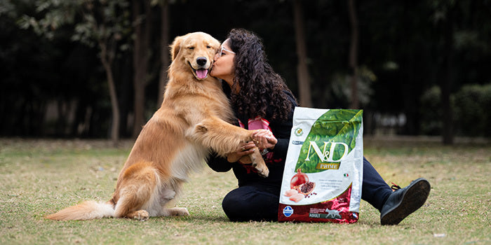 Pet parent with her dog alongside his favourite dog kibble