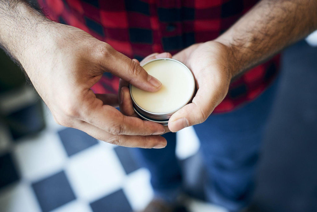 man using beard balm