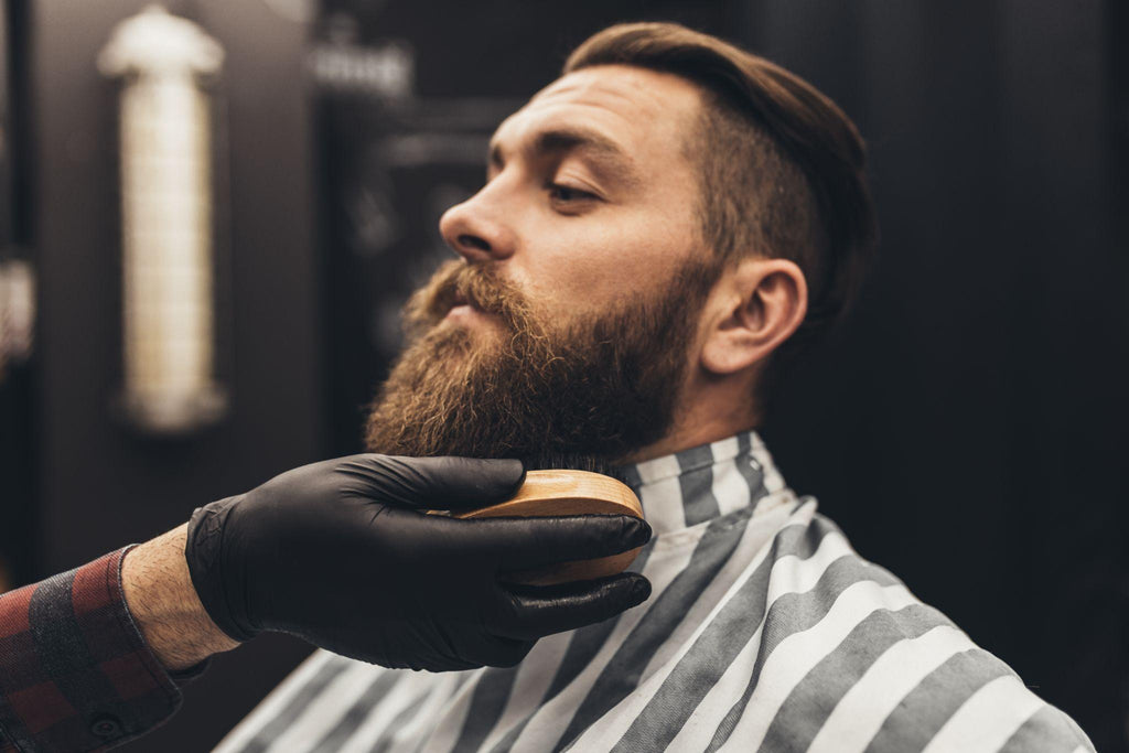 young good looking man visiting barber shop.