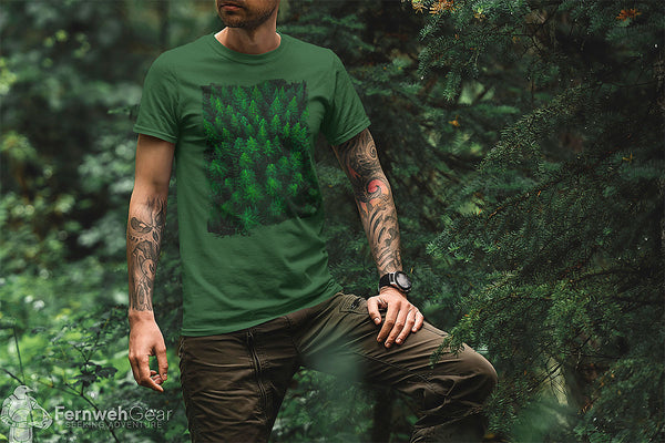 Man in forest wearing Woken Pine Frame unisex green shirt by Fernweh Gear