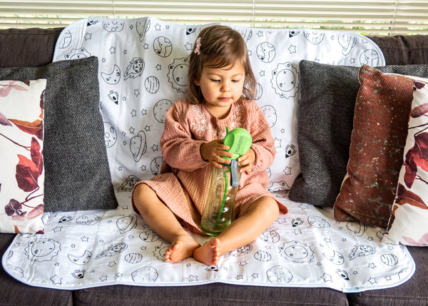 Toddler on our Brolly Sheets Chair Pad