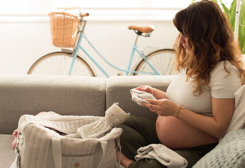 pregnant woman packing her hospital bag