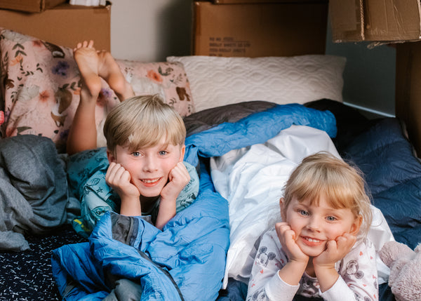 two children, a brother and sister using quality cotton and quilted brolly sheets sleeping bag liners at a sleepover