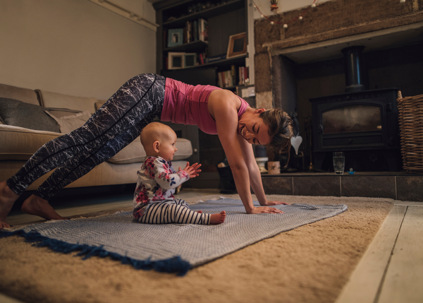 New mum exercising daily with her little baby watching her