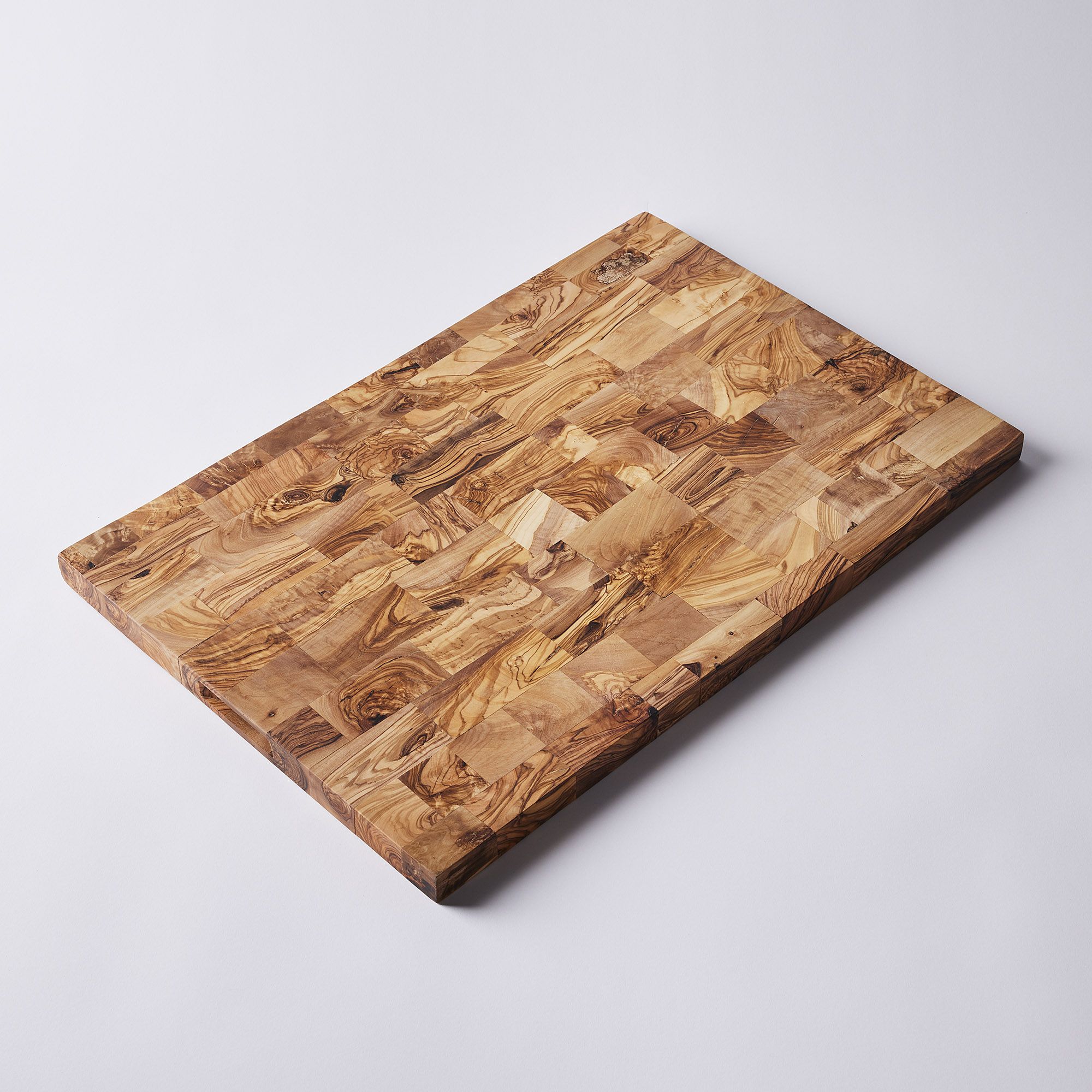 Handcrafted Olive Wood End-Grain Cutting Board - Large - 758e2370-449d-4f35-b928-5eb5a01460dc--2022-0929_food52_handcrafted-olive-wood-end-grain-cutting-board_large-detail_silo_mj-kroeger_copy