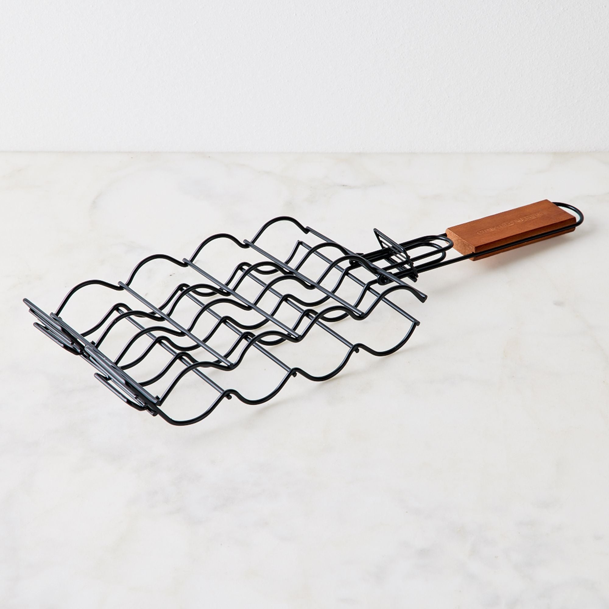 Nonstick Corn Grilling Basket - a3dd06d2-7b7e-4f78-aeda-7193164e8ede--2023-0508_union-square-group_non-stick-corn-grilling-basket-folding-handle_silo_1x1_ty-mecham