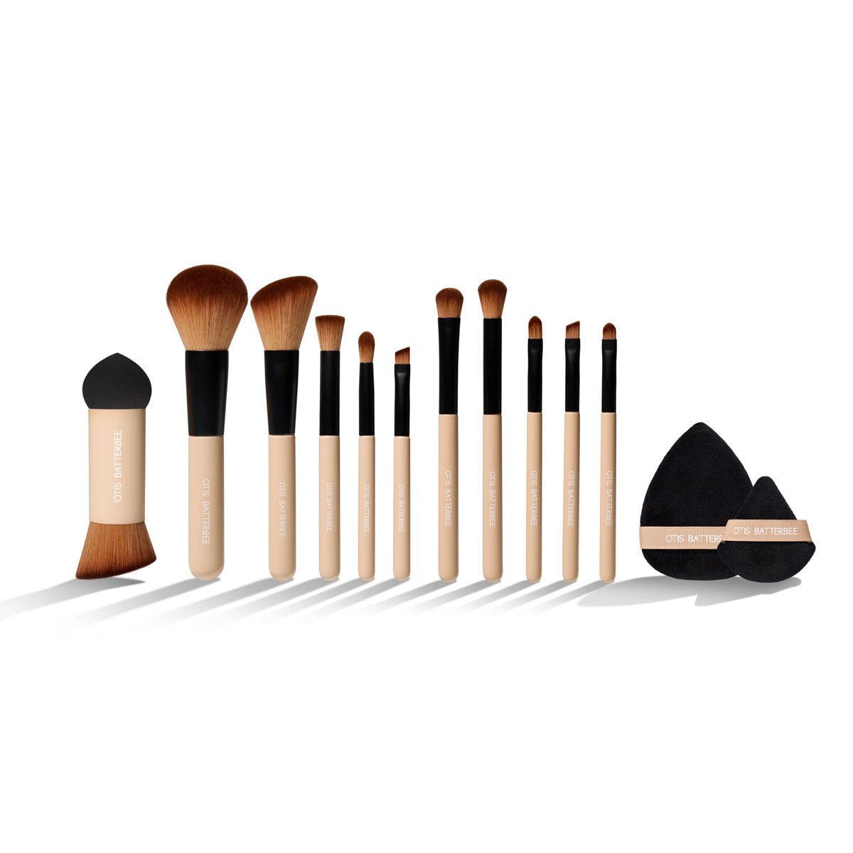 Otis Batterbee Makeup Brush Set: Explore endless possibilities with our curated collection, featuring The Eye Brush Set. Unleash your creativity with these five versatile brushes, offering a perfect blend of softness and density for mesmerizing eye looks. The Face Brush Set comprises five essential brushes for seamless application of blushers, powders, and even lips, ensuring a flawless finish. Elevate your makeup routine with The Powder Puff Duo, featuring two sizes for achieving an invisible look and setting powders for a camera-ready finish. Experience innovation with The Rocket Blender Brush – a dual-function beauty tool combining the benefits of a blending sponge and a makeup brush. Ideal for blending foundation and powders on-the-go, this set is your key to effortless beauty.