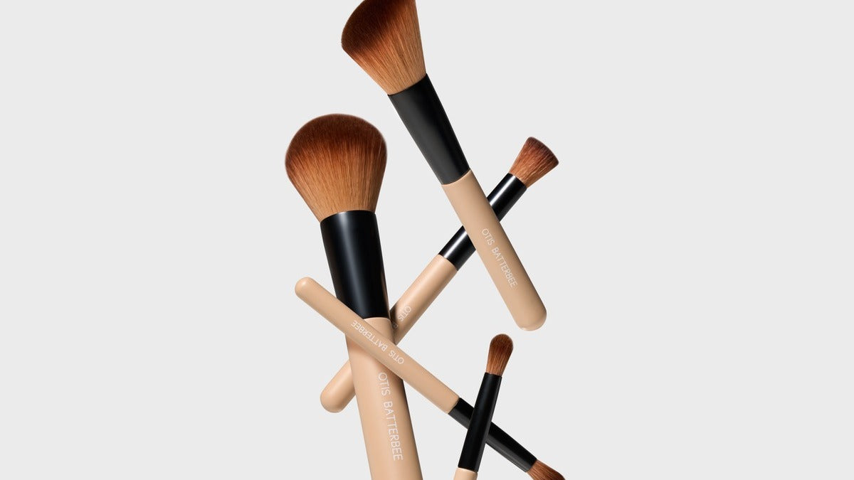 Otis Batterbee Mini Face Brush Set: contains The Powder Brush, The Angled Contour Brush, The Concealer Brush, The Eye Shadow Brush, and The Eye Detail Brush.