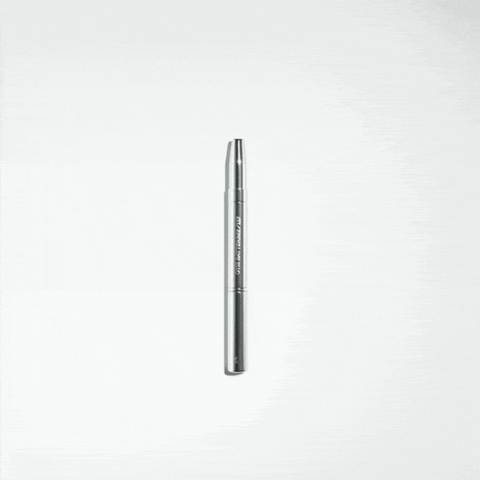 Otis Batterbee's Retractable Brush Duo: Sleek silver metal brushes for precise makeup application, including concealer