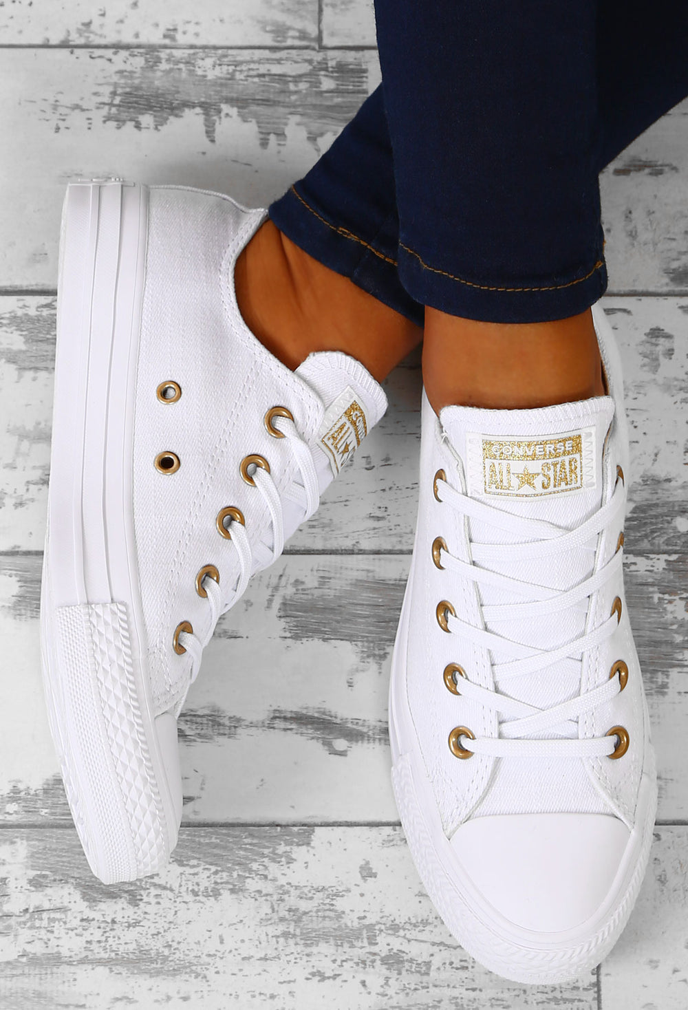 white converse with gold eyelets