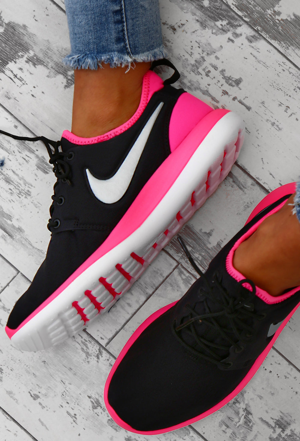 black and pink trainers