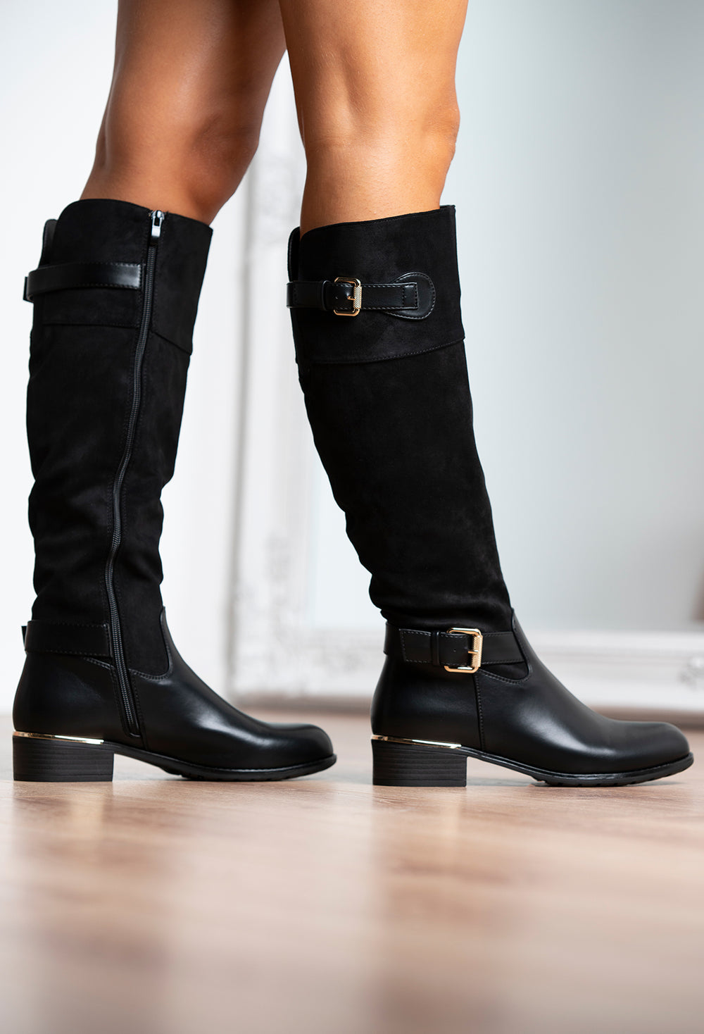 black knee high boots with gold trim