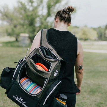 Woman Carrying a Pack of Frisbees for Disc Golf