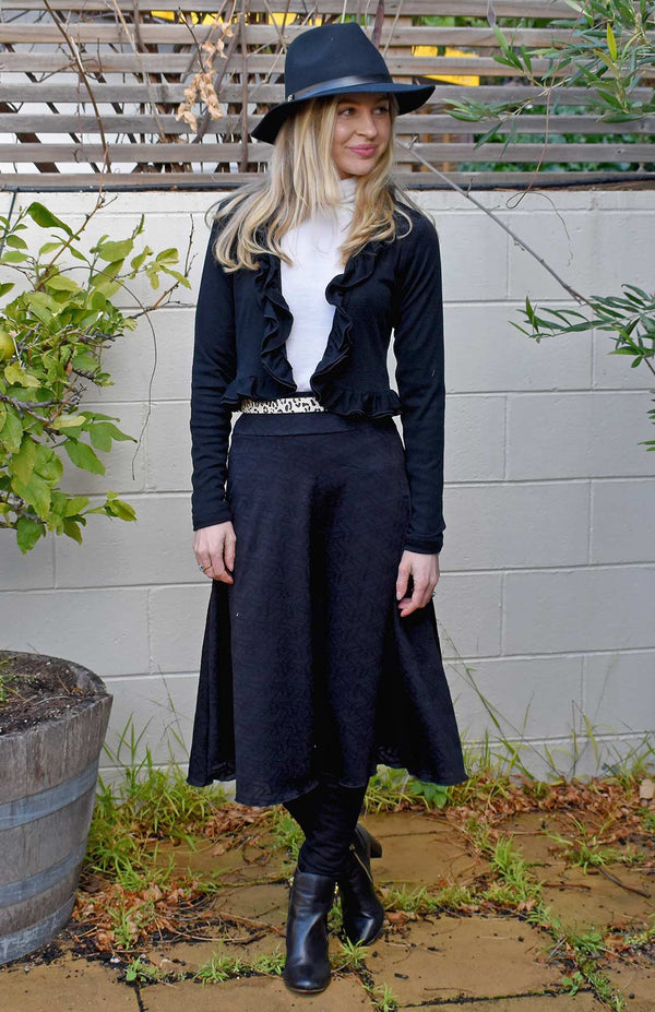 Holly wearing twirl skirt in black zig-zag pattern