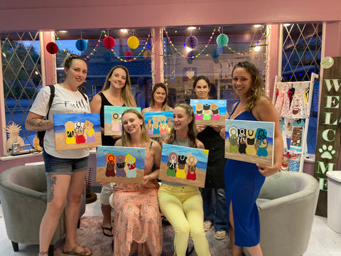 Group with summer beach paintings at Craft Theory paint party