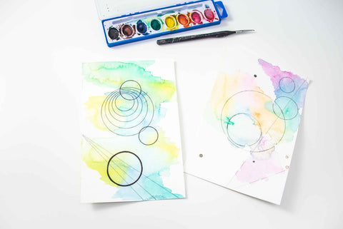 Watercolor papers with set of watercolor paints