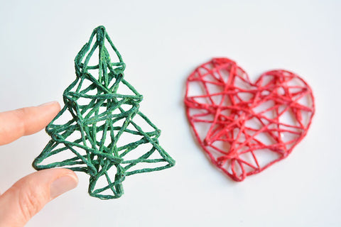 Green Christmas tree and red heart made with yarn