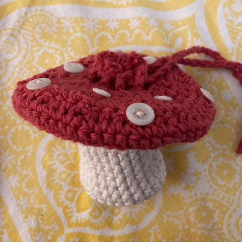 A crocheted mushroom pouch by Lou