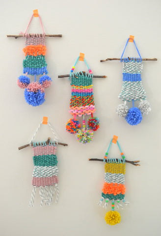 5 woven wall hangings with tassels
