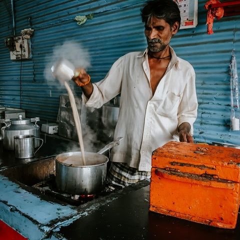man making chai