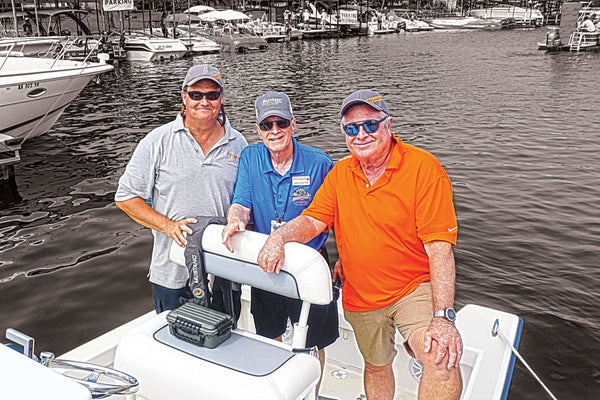 Steve Trkla, president of Torqeedo Inc. USA (left) and Bob May, of Bob’s No Wake Zone Radio and the official race emcee (middle), meet up with the author and Calypso/Torqeedo electric-motor skipper, Randy Vance (right). Courtesy Brent Vance