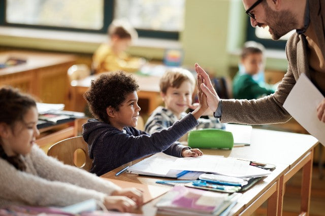 Back to School Health Essentials from Hargraves Online Healthcare vitamins are important for student success image of teacher giving student a high five