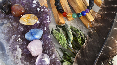 how to cleanse crystals by laying them on an amethyst cluster