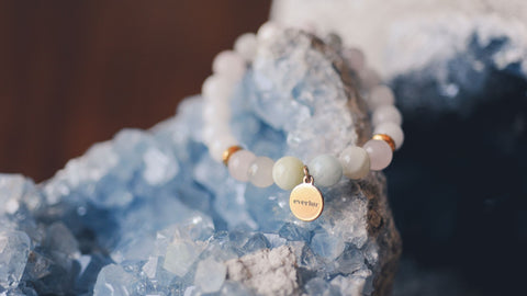 Crystal bracelet laying on crystal for manifestation