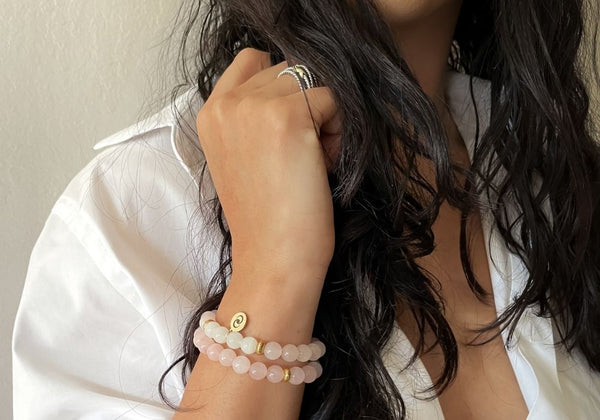 woman wearing the love crystal bracelet to manifest love