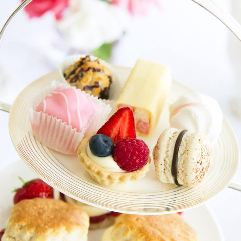 A tiered cake stand with high tea treats