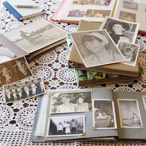 Old photos and albums on a lace tablecloth